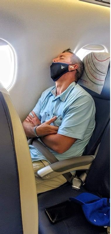 Jason Sucher asleep on the plane