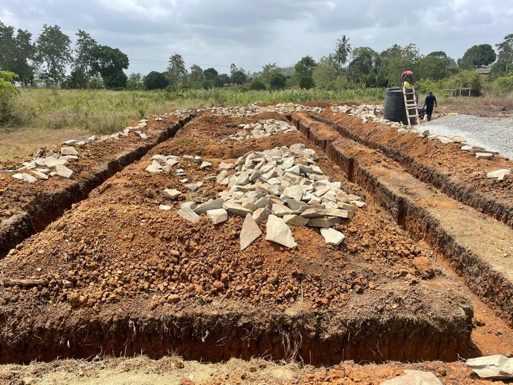 dirt marked out for the foundation for the new school