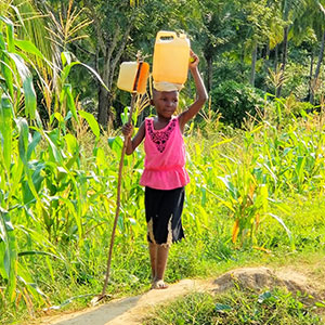 Girl carrying water on head