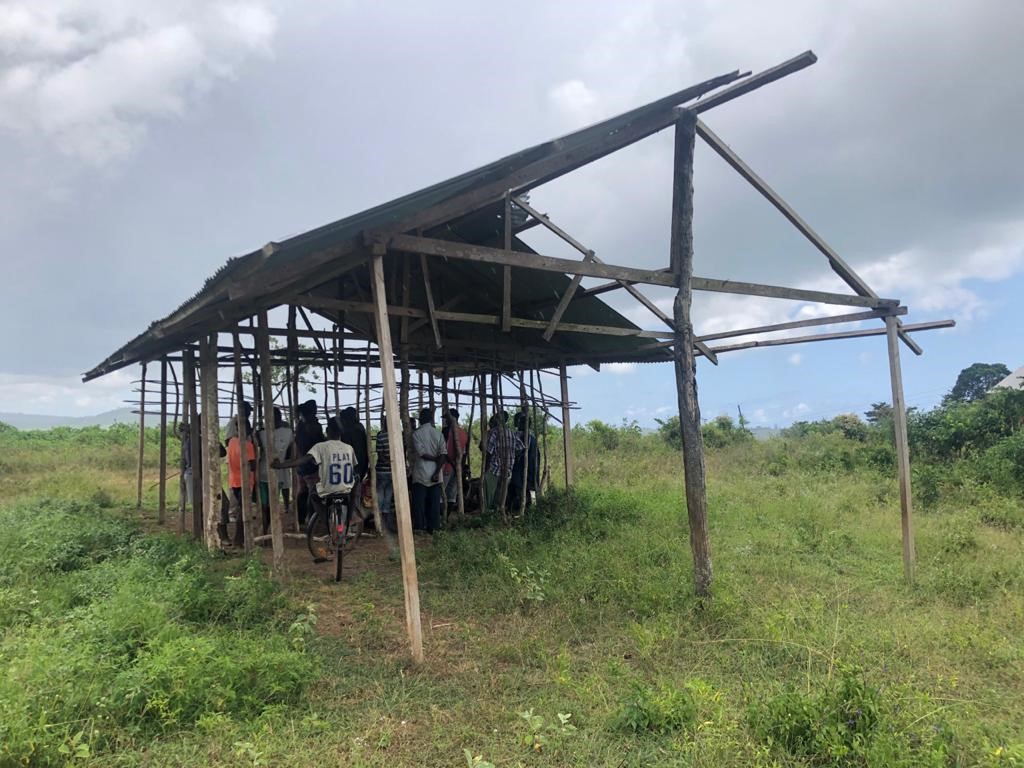 Villagers of Lutsanga in a unfinished building