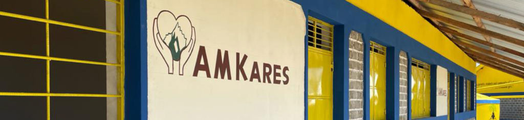 Side of School with AM Kares sign